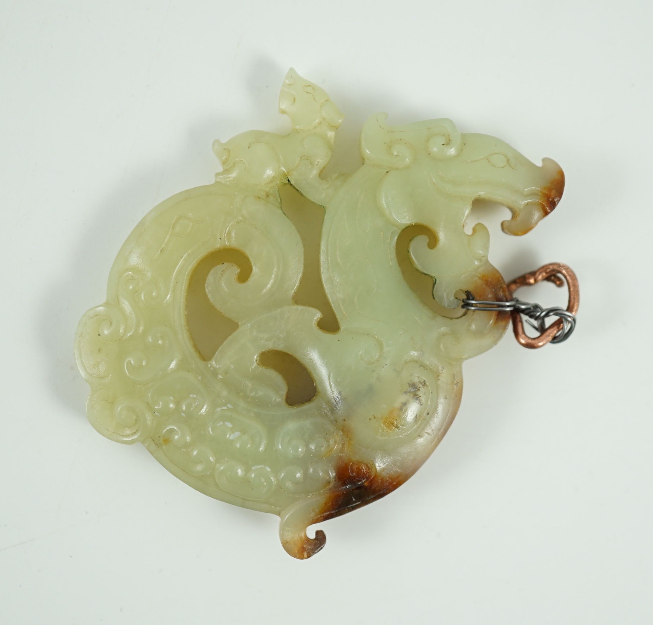 A Chinese archaistic yellow and russet jade openwork plaque, possibly Song-Yuan dynasty, 6.8cm